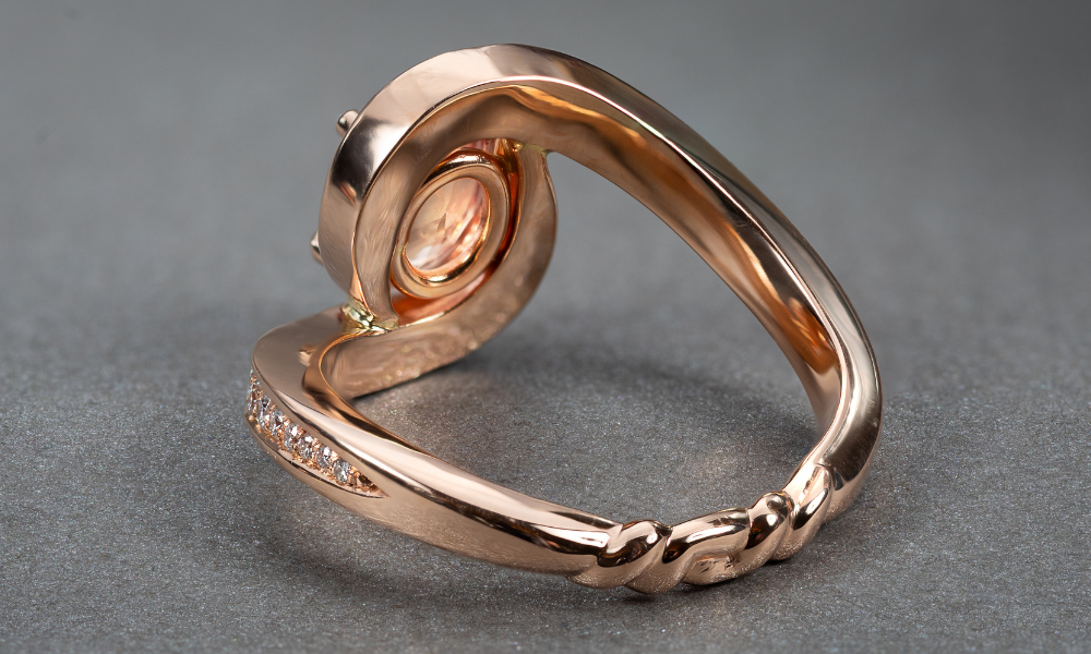 Rare padparadscha sapphire with bespoke gold detailing UK