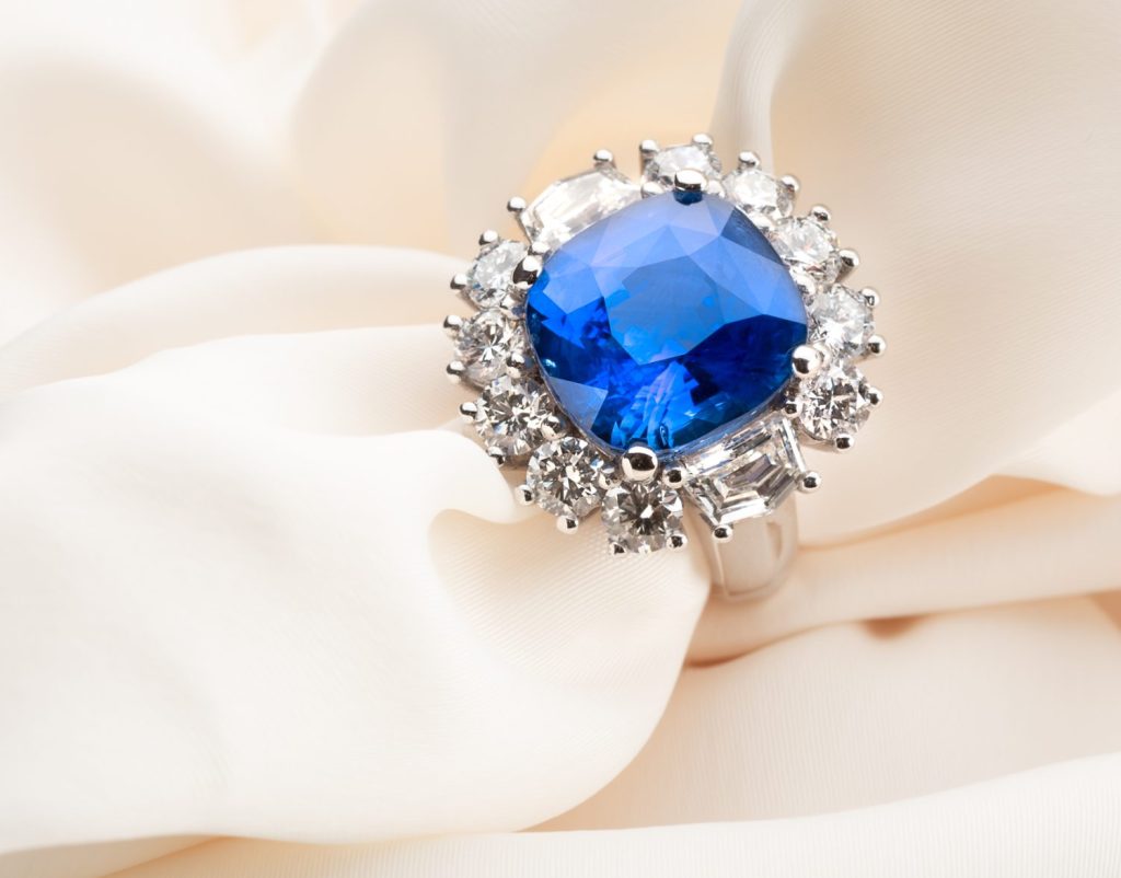 Exceptional 11ct Cornflower blue sapphire and diamond cluster ring. with lotus gemlab report