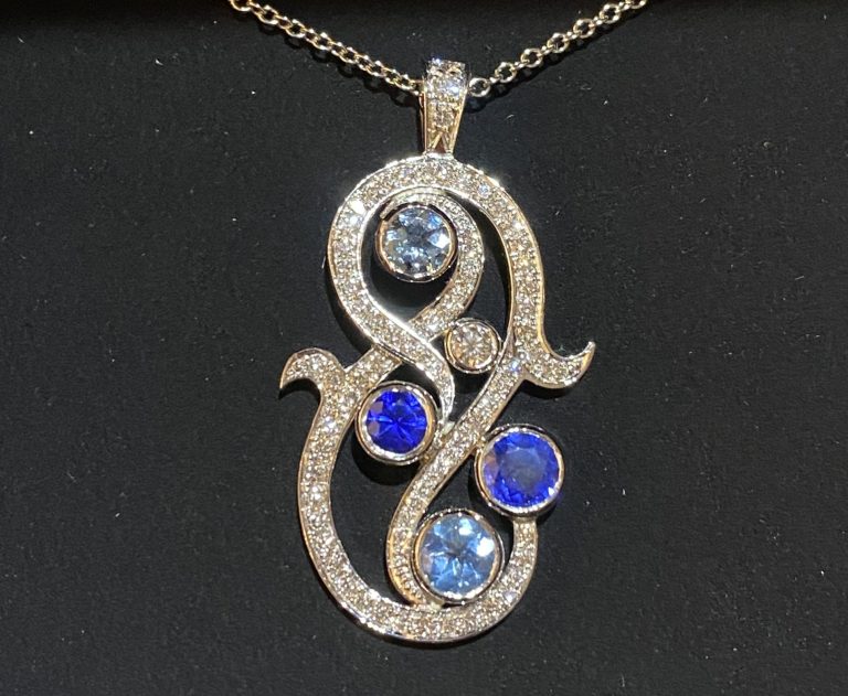 Exquisite sapphire aquamarine and diamond pendant. N J Geddes